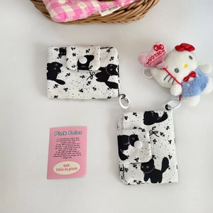 Detail of cute cat pattern fabric coin purses with snap closure and hook attachments