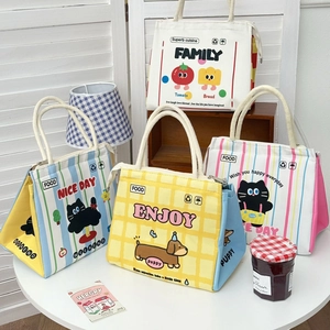 Detailed view of cute cartoon lunch bags with zip closure and cotton rope handles