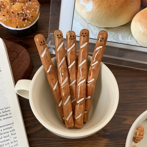 Five-piece set of creative baguette-shaped ceramic coffee stirrers with cute smile design