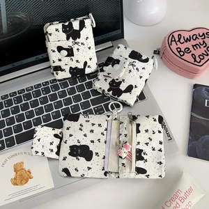 Detailed view of cat print canvas wallet interior with card slots and a zipper coin pocket