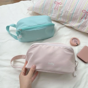 Large capacity minimalist cosmetic bag in blue and pink with handle and zipper closure
