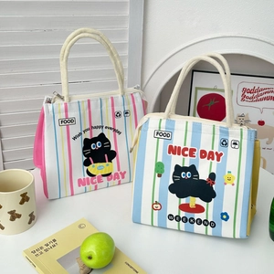 Detail of cute cartoon lunch bags with colorful stripes and thickened aluminum foil lining