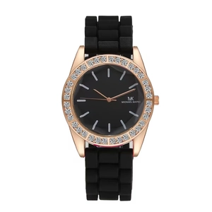 Close-up of black quartz watch with rose gold diamond bezel and silicone strap