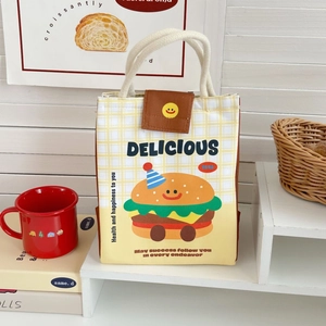 Detail of yellow checkered lunch bag with cartoon burger print and cotton rope handle