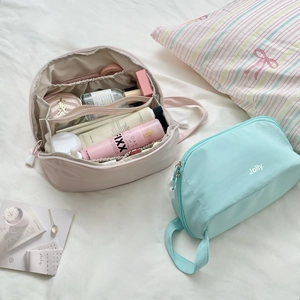 Portable large capacity travel makeup bags in pink and blue with multi-compartment storage
