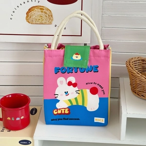 Detail view of thickened aluminum foil lining inside the cute cartoon thermal lunch bag