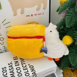 Close-up of cute pelican plush coin purse with red zipper and soft fabric texture
