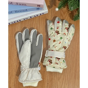 Detailed view of winter ski gloves with anti-slip palms and festive Christmas patterns