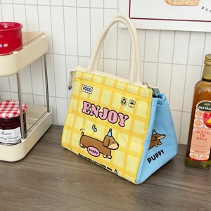 Detailed shot of yellow plaid cartoon lunch bag with thick aluminum insulation and rope handle