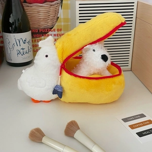 Macro detail of pelican plush makeup bag with yellow fleece texture and red zipper closure