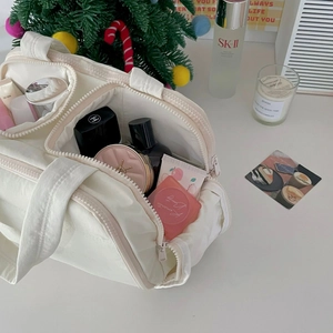 Quilted cream vanity bag with handle and zipper for large capacity makeup storage