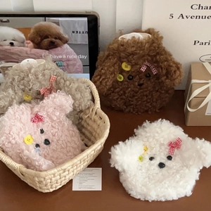 Cute teddy dog plush hot water bottle in four colors within a woven basket setup