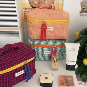 Three-piece quilted checkered cosmetic bag set with tassels and sturdy handles