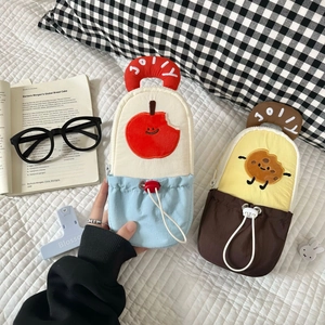 Detail of cute cartoon pencil cases with JOLLY embroidery and drawstring front pockets
