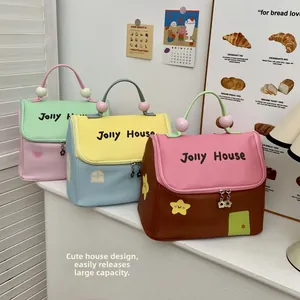Detailed view of spacious house-shaped cosmetic bags with top handles and zippers