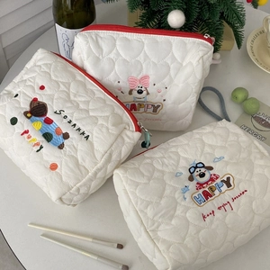 Three-piece white quilted dog cosmetic bag set with heart pattern and red zippers