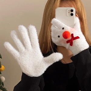 Detail of white plush Christmas snowman gloves with red bow and 3D orange nose decoration