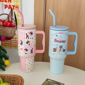 Portable stainless steel thermal mugs with cute dog illustrations and ergonomic handles