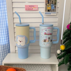 Detail of 1200ml stainless steel tumblers with Westie puppy prints and sturdy side handles