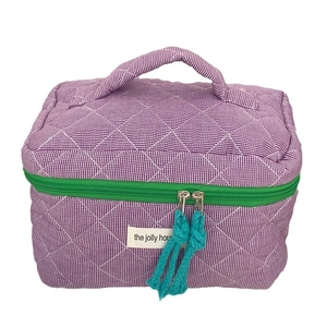Quilted purple checkerboard vanity case with contrast green zipper and blue puller