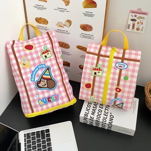 Pink checkered canvas organizer bag with yellow handles and cute Rainbow Dog cartoon prints
