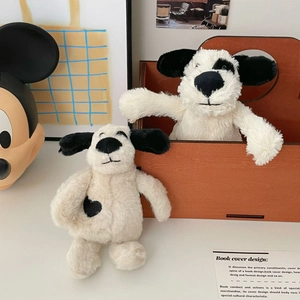 Cute spotted plush dog toy set with black heart detail on soft cream white fur
