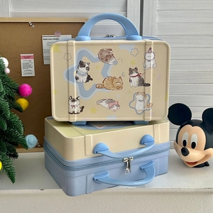 Detail of cartoon cat pattern on 14-inch mini hardshell vanity cases with sturdy handles