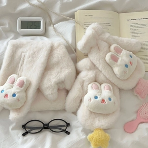 Detail of plush cream bunny scarf and mitten set with soft stars and cute ear embroidery