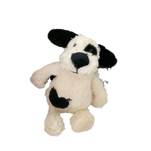 Cute spotted plush puppy dog toy in a sitting position with soft black and white fur