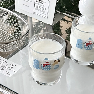 Detailed view of snowman and puppy holiday prints on clear hourglass glass mugs