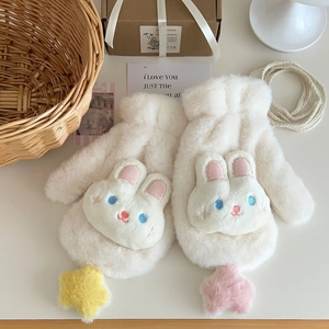 Detail of plush white mittens with rabbit embroidery and colorful star charms