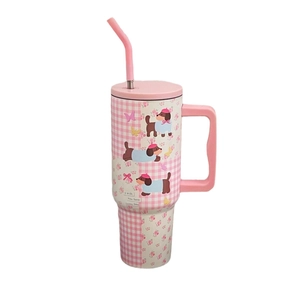 Pink stainless steel insulated tumbler with floral dachshund pattern and sturdy handle