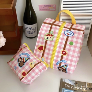 Pink checkered travel storage bag set with cute cartoon dog and waterproof fabric detail
