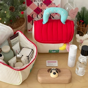 Cute house-shaped quilted cosmetic bag with mint green handle and beauty embroidery