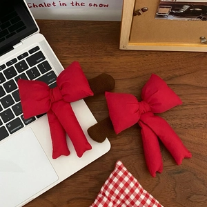 Festive red bow door handle covers with elk horn accents for winter holiday home decor
