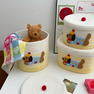 Three-piece dog patch cotton rope baskets with lids and cute red ball handles