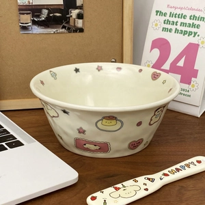 Close-up of wavy cream ceramic bowl with cute puppy and star patterns on wooden desk