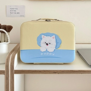 Detail of yellow and blue leather makeup case with puppy print and metal double zippers