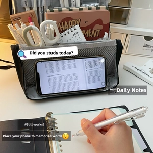 Detailed view of grey mesh organizer bag with multi-layer compartments and stand function