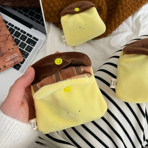 Cute plush pudding coin purse with yellow body and brown flap for earphone storage
