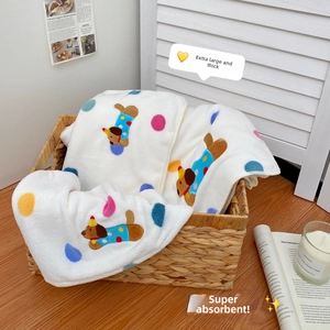 Macro view of ultra-soft dalmatian pattern bath towel and fluffy fleece fabric texture