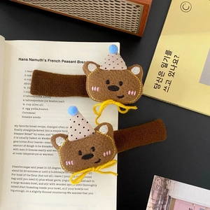 Cute brown plush bear door handle covers with polka dot hats and yellow ribbons