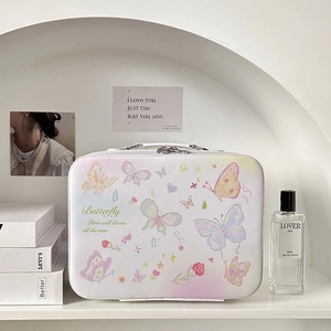Close-up of white butterfly print storage bag on a modern aesthetic display shelf