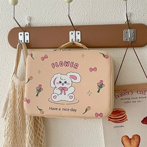 Detail of cute rabbit illustration on a large capacity PU leather cosmetic suitcase