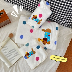 Detail of soft spotted dog cartoon towel set with premium absorbent flannel texture