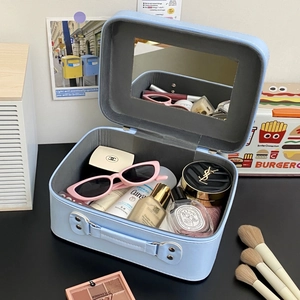 Detail view of large capacity makeup case with built-in mirror and cosmetic storage