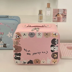 Pink PU leather makeup bag with cartoon dog patterns and embroidery in a cozy setting