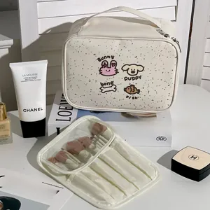 Detail of cartoon makeup bag with compartments and a removable makeup brush holder