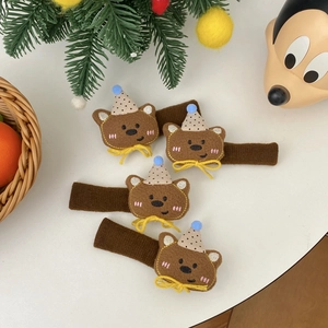 Detailed view of plush bear door handle covers with polka dot hats for winter protection