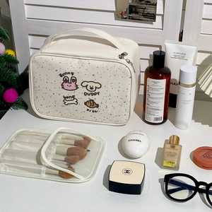 Detail of white cartoon makeup bag with cute animal patterns and large interior capacity